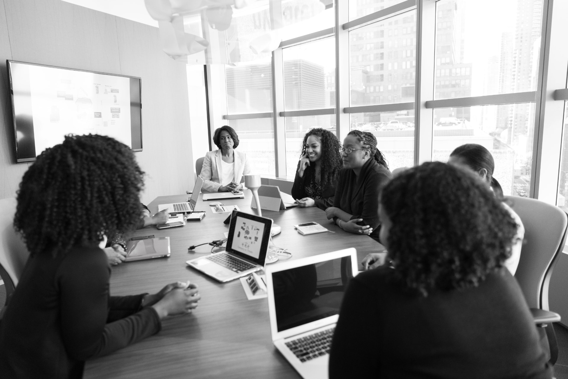 Ministry team reviewing documents together around a conference table